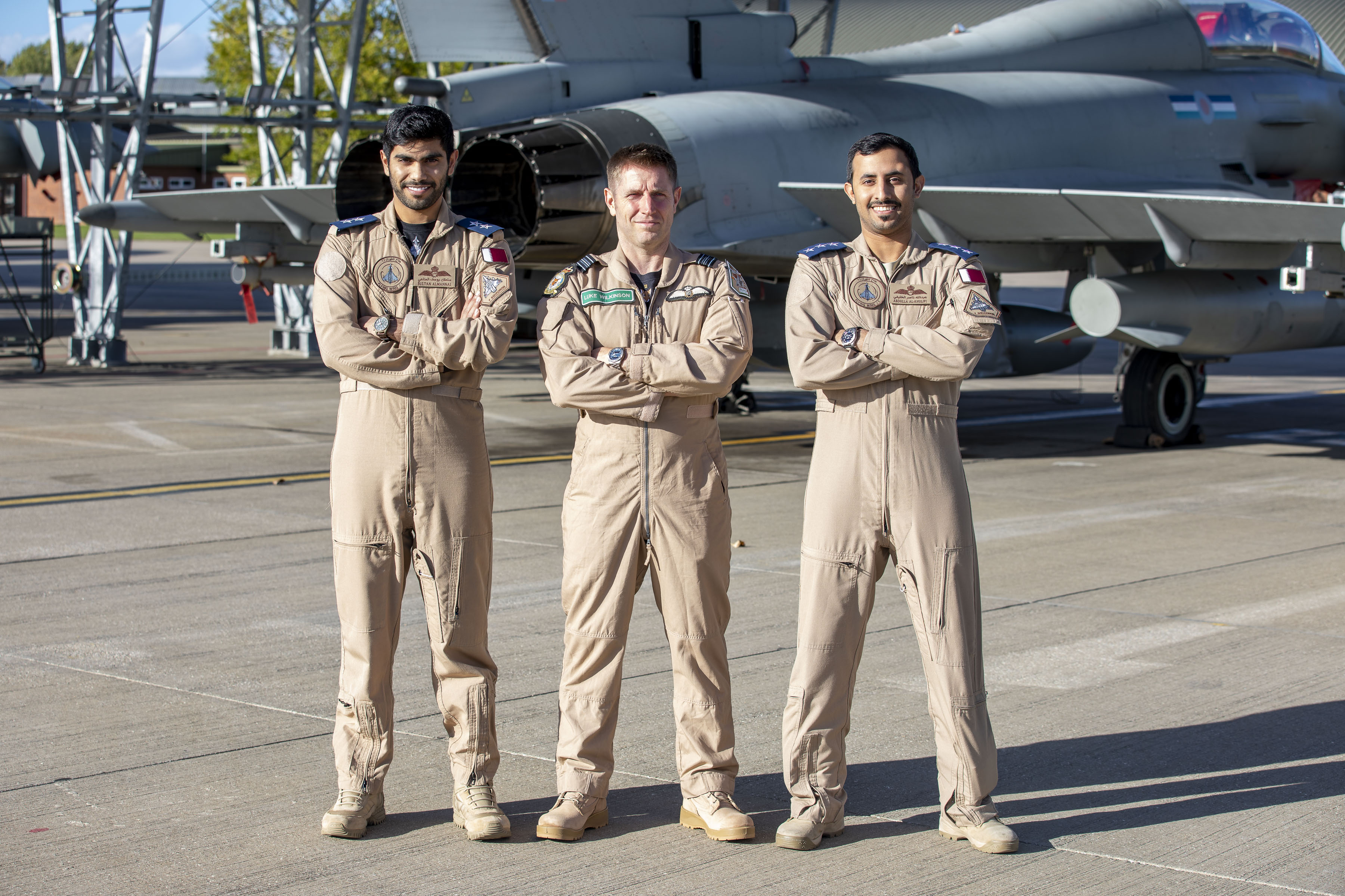 Image shows personnel on the airfield with fighter jets.